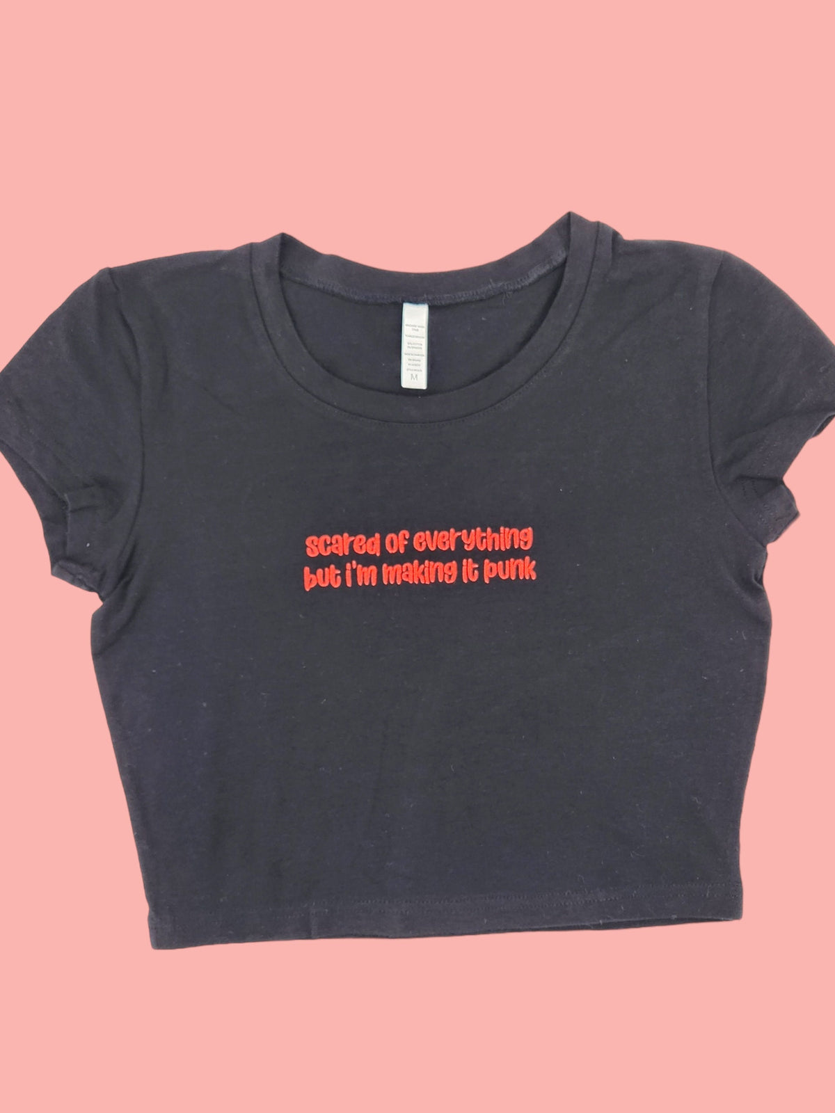 a black t - shirt with a message on it