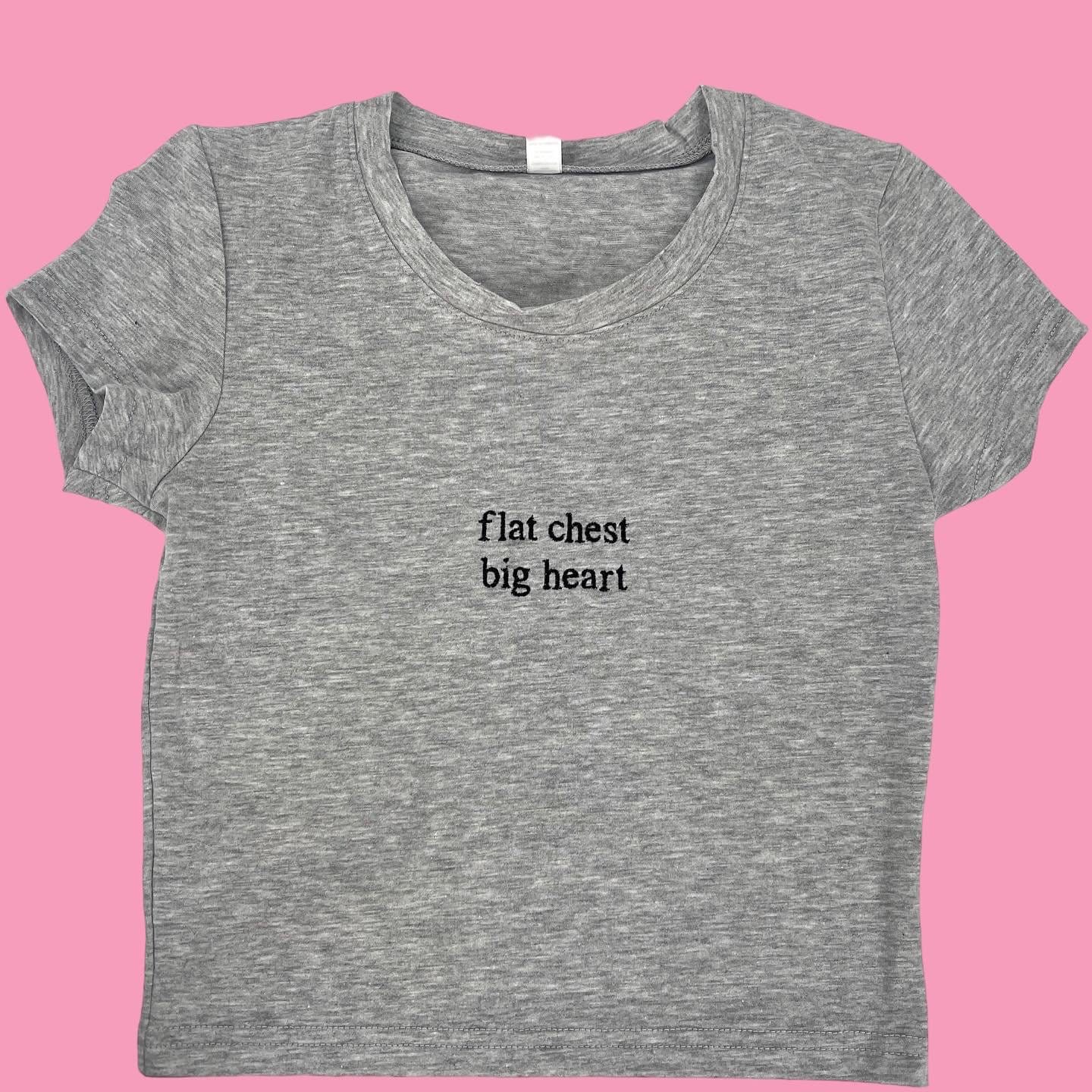 a t - shirt that says flat chest, big heart