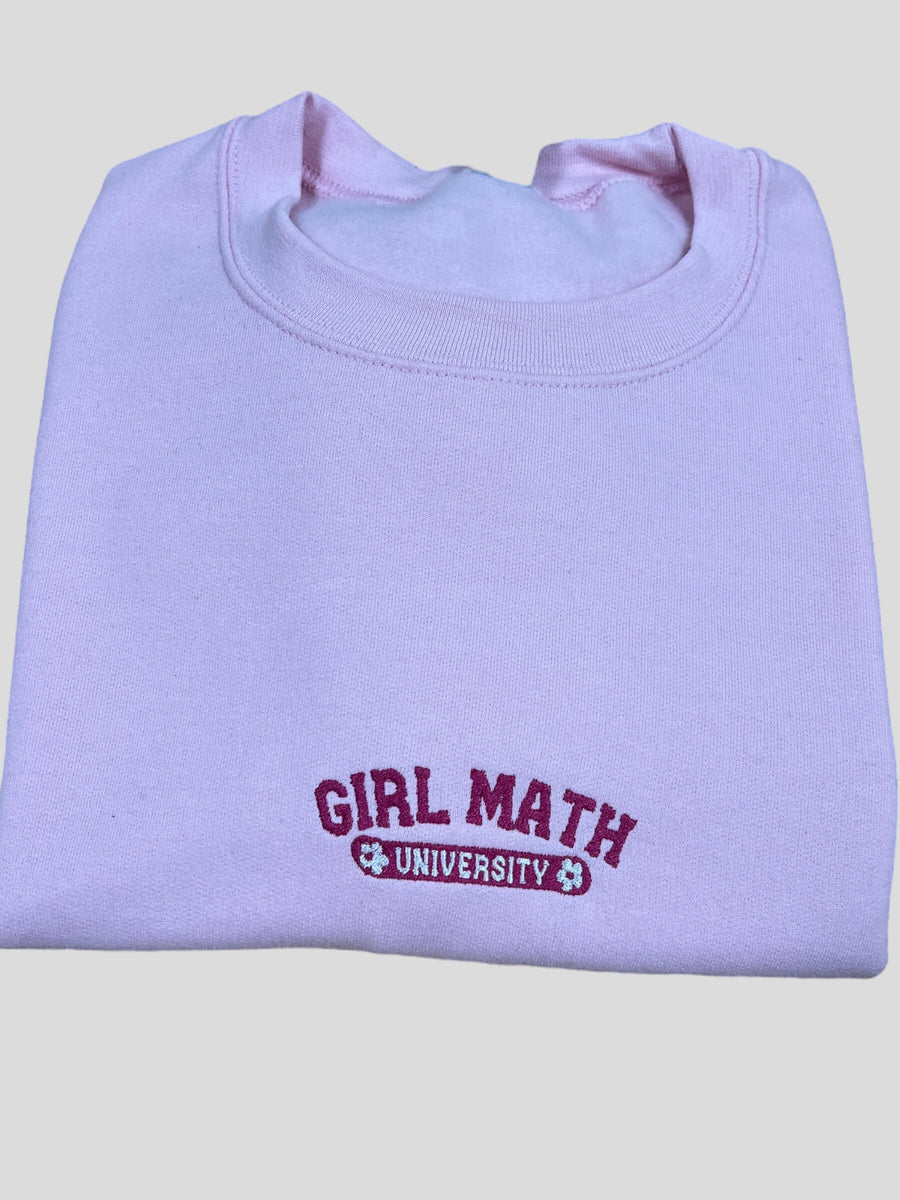 a purple sweatshirt with the word girl math on it
