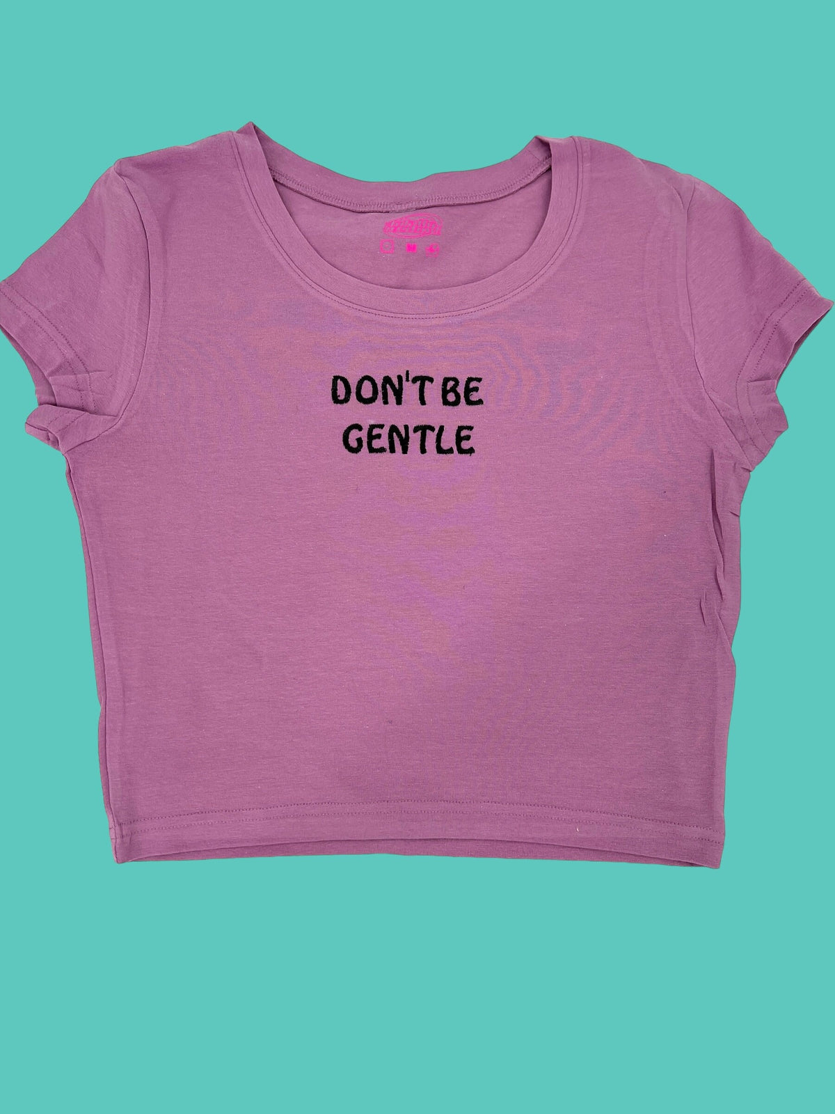 a pink shirt that says don&#39;t be gentle