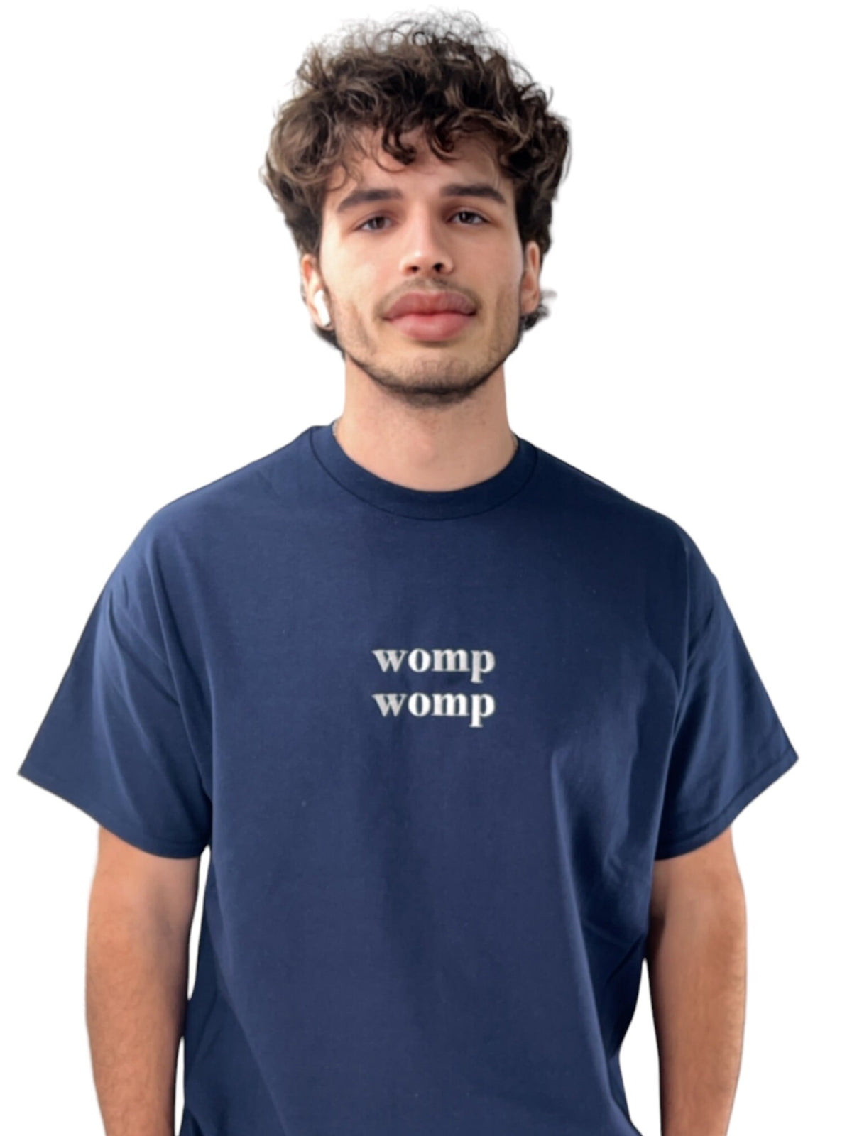 a man wearing a blue t - shirt that says women womp