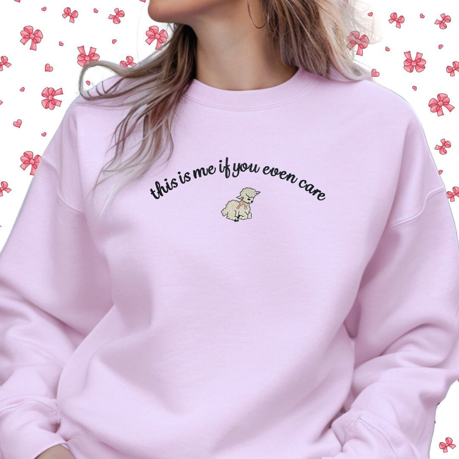 a woman wearing a pink sweatshirt with the words,&#39;this is me if you