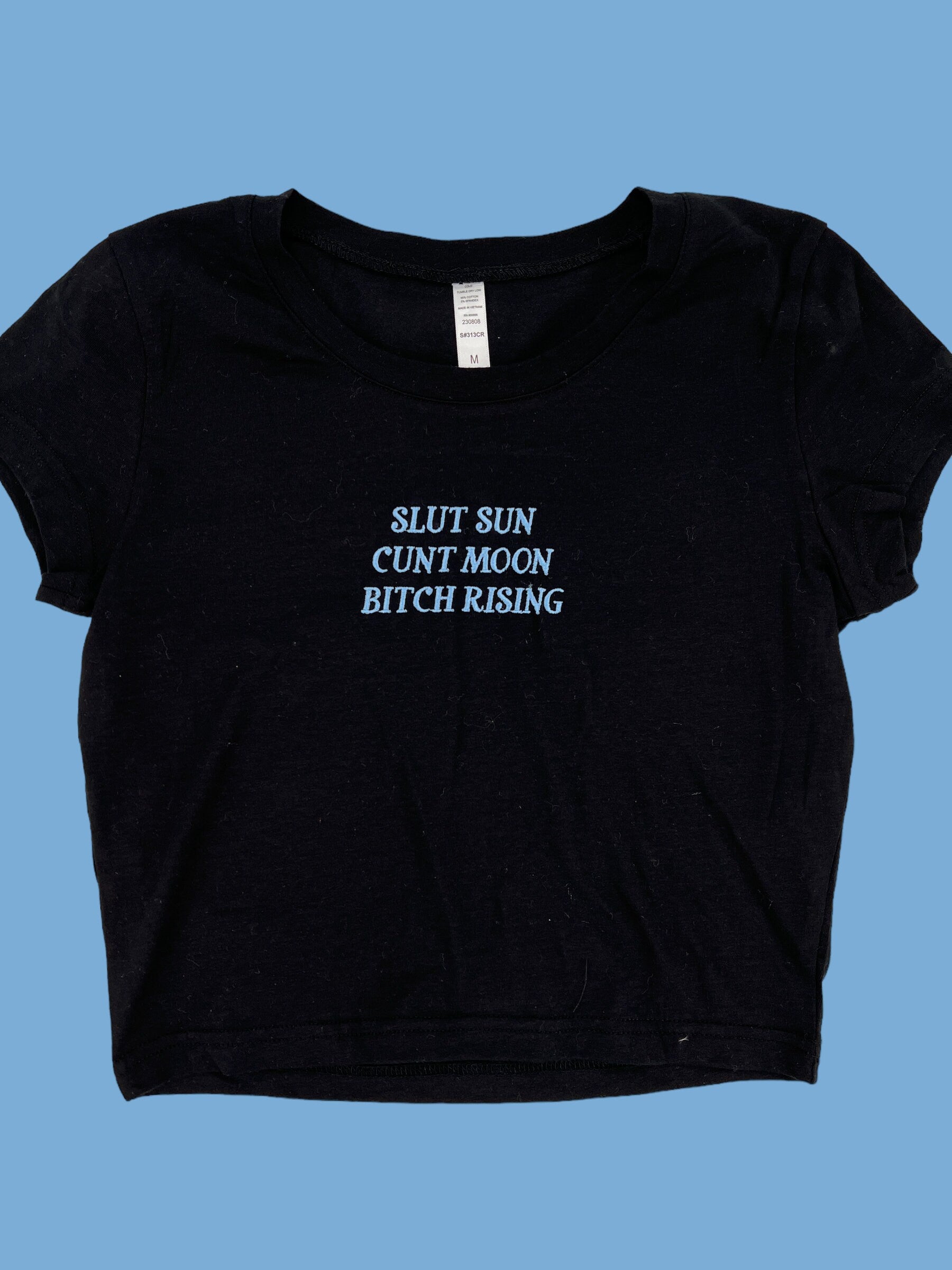 a black t - shirt that says slut sun, cunt moon, bitch
