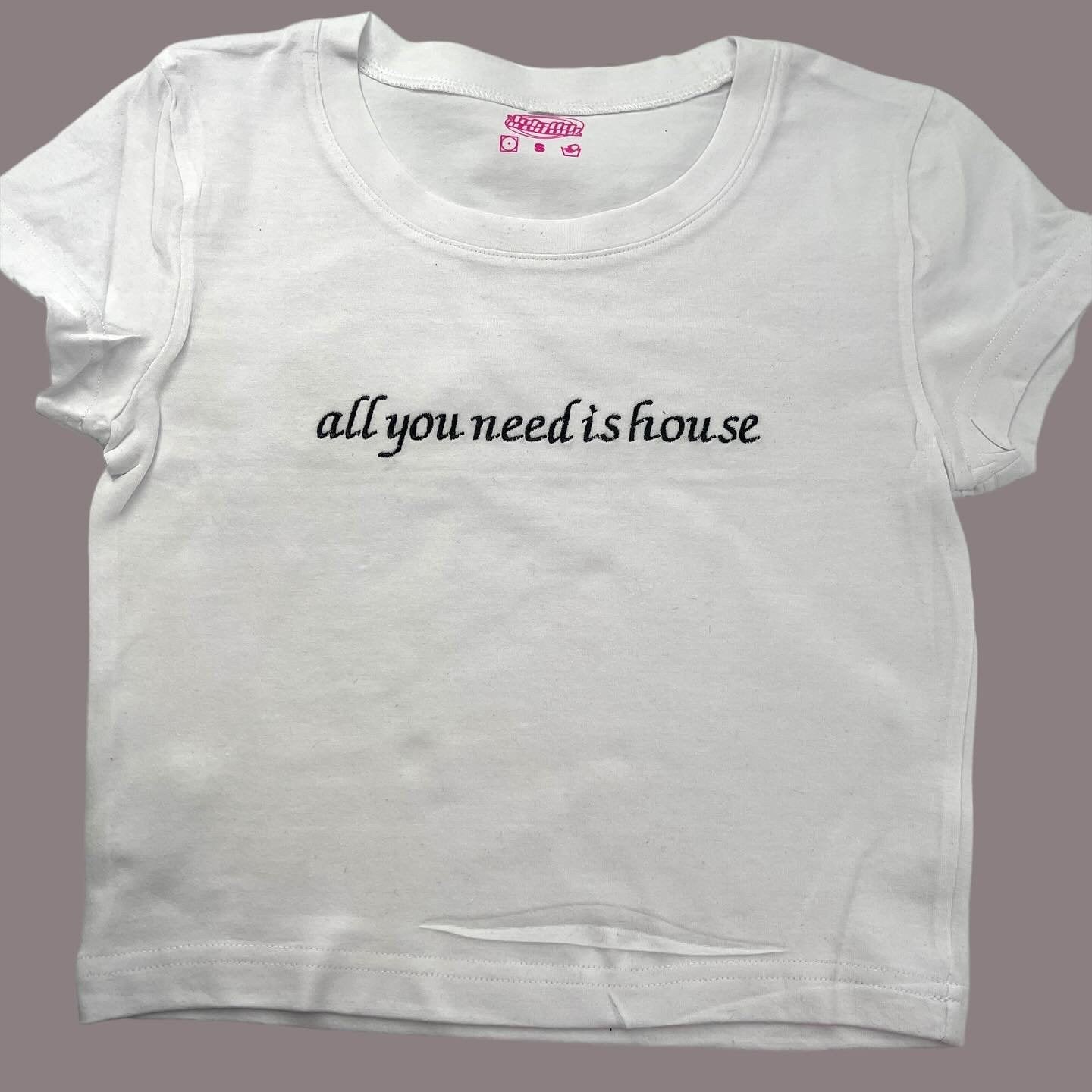 a white t - shirt that says, all you need is house