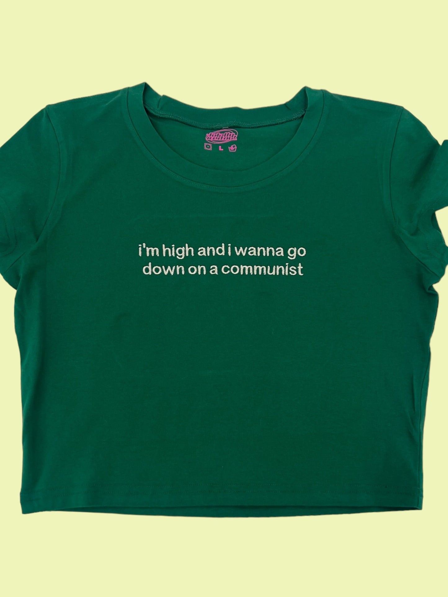 a green t - shirt with a quote on it